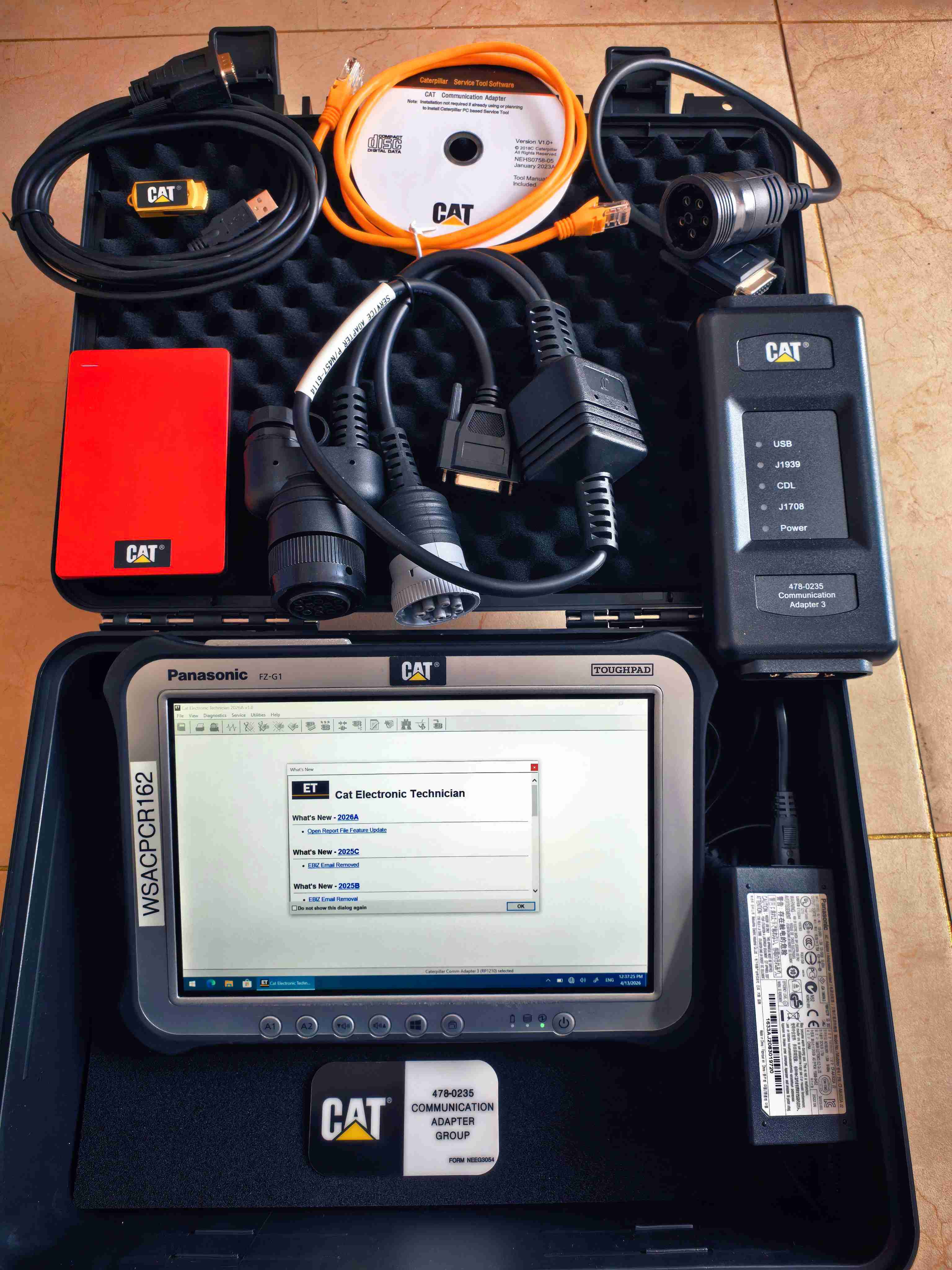 Caterpillar ET testing new CAT 4th generation Ethernet with SIS rugged Panasonic flatbed programming board 2026A